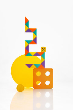 Playful geometric still life assembled from colorful household objects