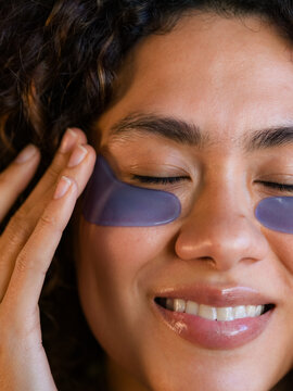 Woman Applying Under-Eye Patches