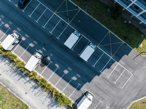 Aerial view of delivery trucks in parking lot