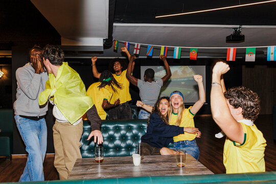 Diverse spectators celebrating world championship soccer match