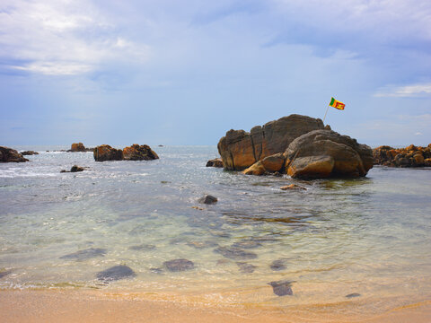 Secret Beach at Mirissa with Sri Lankan Flag