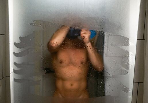 Man Takes a Photo in Bathroom With Foggy Mirror After Shower
