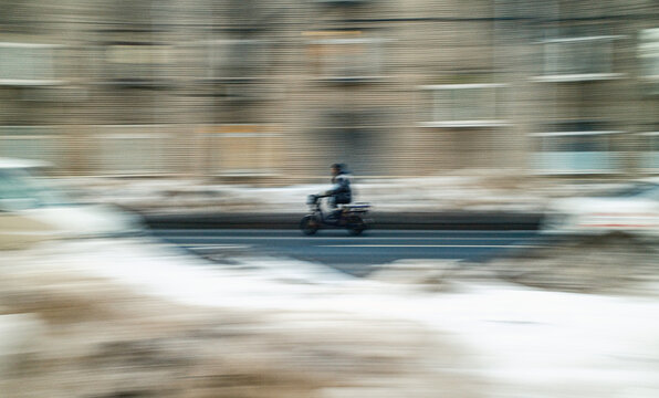 Fast Riding An Electric Bike In Winter City