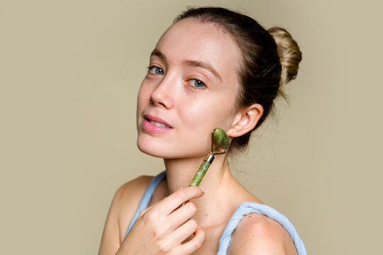 Woman Holding Jade Roller