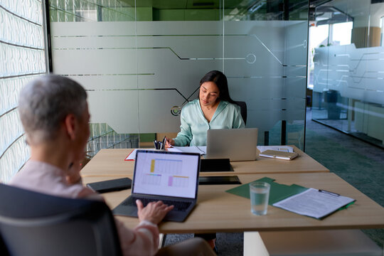 Women focused on their work tasks in a shared office