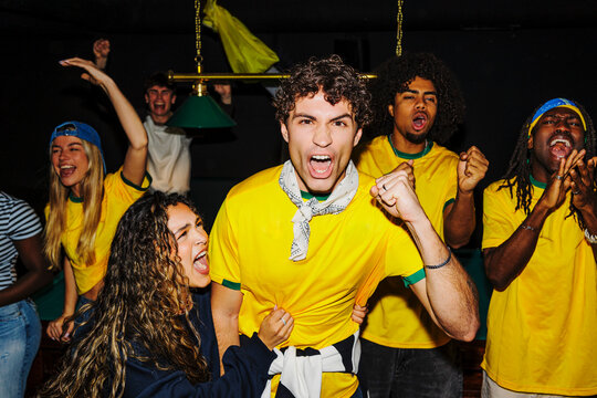 Passionate sport fans cheering for team victory