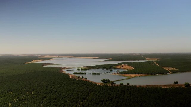 Drone view of a River running through farmland in Modesto, California