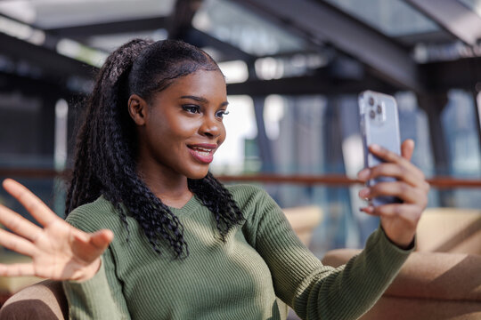 Woman gesturing while talking on video call 