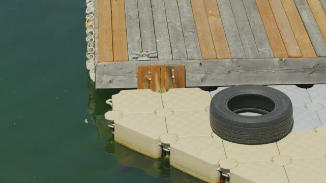 Modular floating dock extension with tire bumper protection