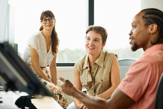Group Discusses Business Ideas in Office