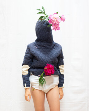 A woman wearing a coat backwards 7