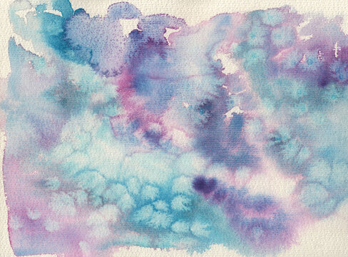 Granulating watercolor painting in blue and purple