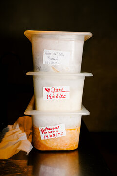 Plastic containers filled with gourmet foods and ingredients