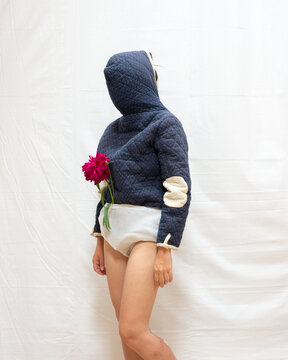 A woman wearing a coat backwards 15