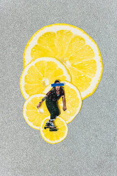 Analog collage skateboarder with silver and lemon slices