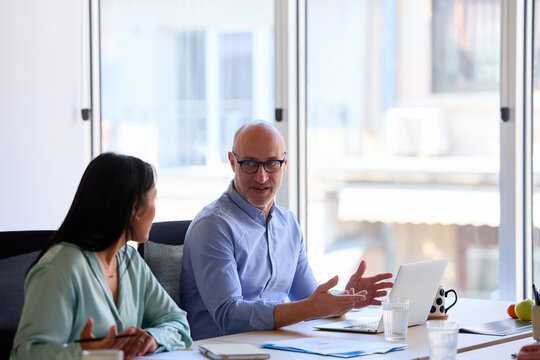 The manager speaks on a meeting with his colleague