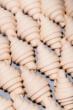 Puff paste croissants arranged ready for baking