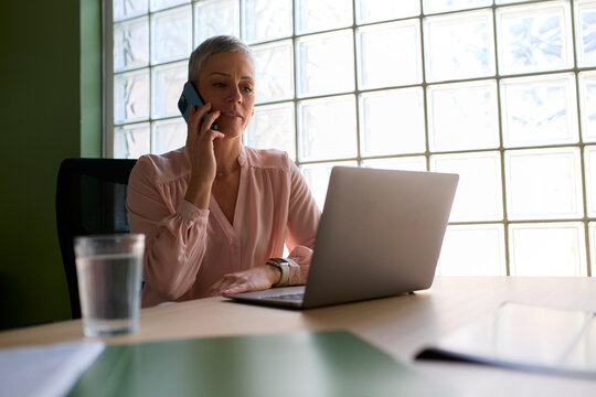 Portrait of a businesswoman speaks on the phone