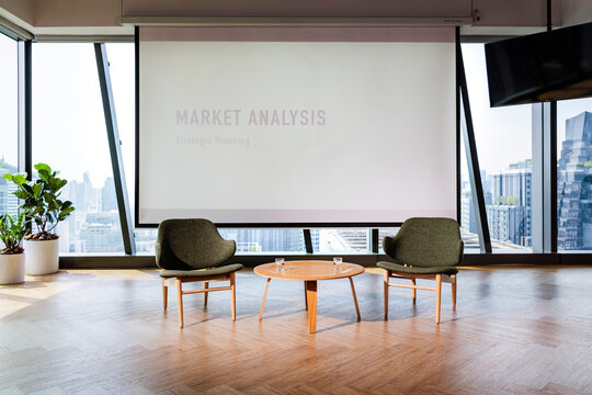 Modern office space with market analysis presentation.