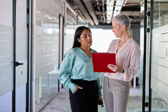 Women engage in business discussions at work