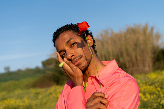 Portrait man with poppy 