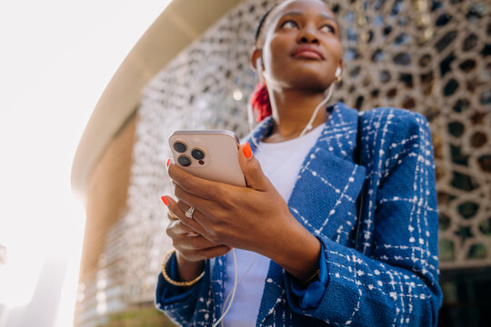 A woman using a mobile phone in the city