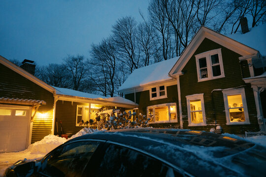 House and driveway covered in snow after a blizzard