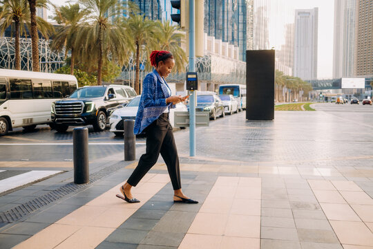 A woman using a mobile phone in the city