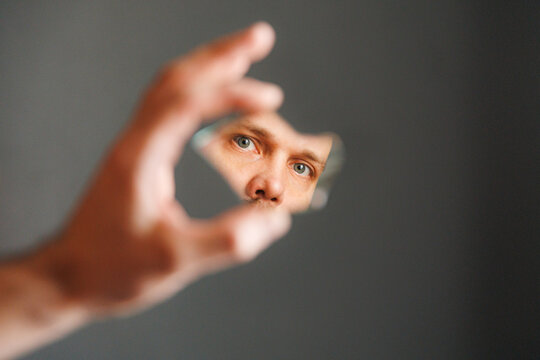 Deeply Looking Through a Broken Glass Piece at a Person's Eye