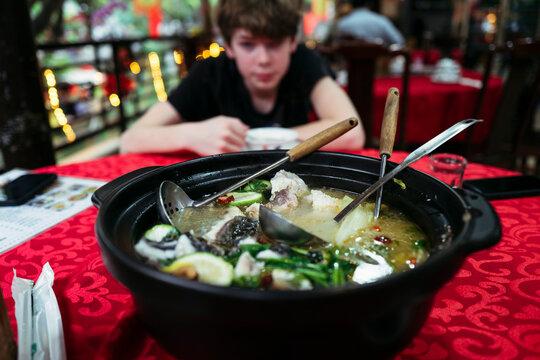 Experience the Rich Flavors of a Hearty Fish Stew at a Restaurant