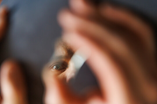 Reflection in a Broken Glass Surface During a Close-Up Examination