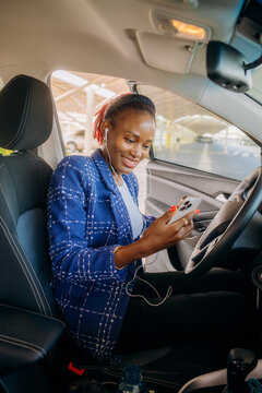 A woman using a mobile phone in a car