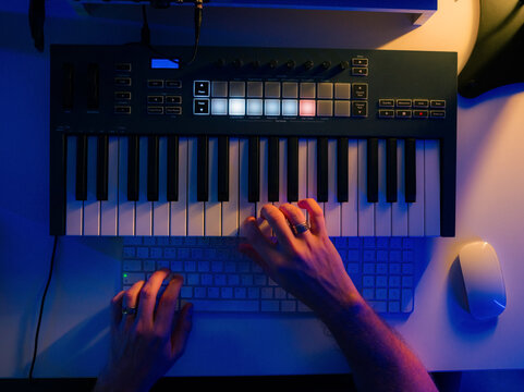 Music Production Session With Keyboard and Computer Setup at Night