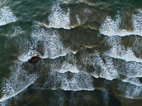 Waves crashing over rock formation in Tulum Mexico sea