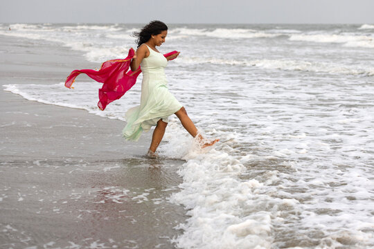 Indian woman enjoying beach time  