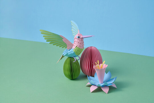 Paper hummingbird with easter egg and flower decor