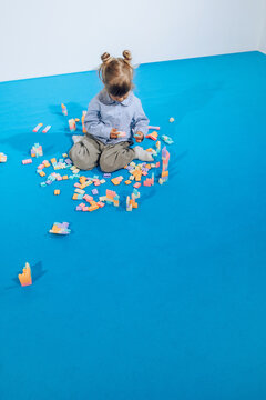 Toddler girl playing on floor