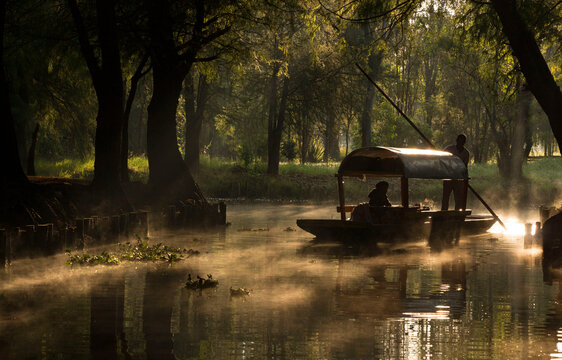 traditional trajinera at sunrise in Xochimilco, Mexico city