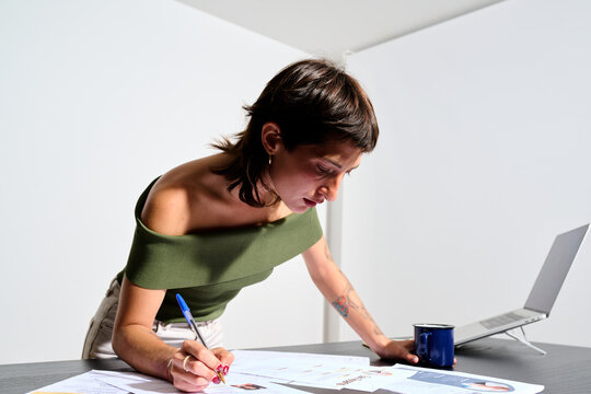 Businesswoman writing notes