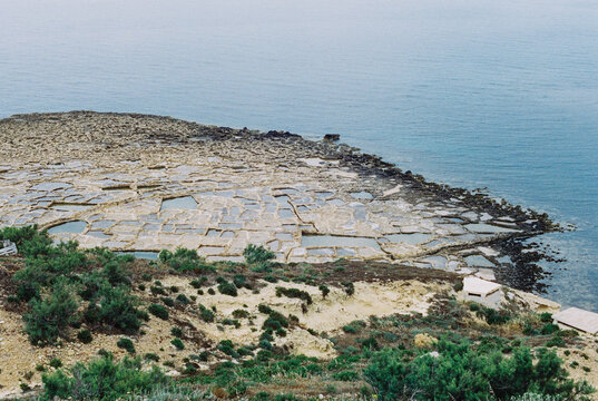 Salt pans along the Maltese coastline