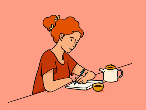 Woman writing in a notepad drinking tea