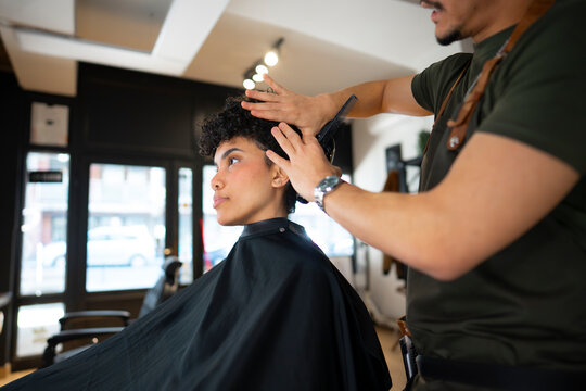 Client getting a haircut at a barbershop
