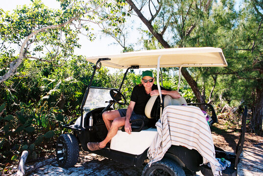 Travel Portrait of Man on Golf Cart in the Bahamas