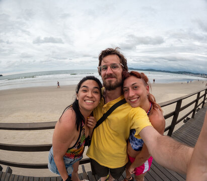UGC Selfie Of Friends Enjoy a Day at the Beach in a Coastal Town