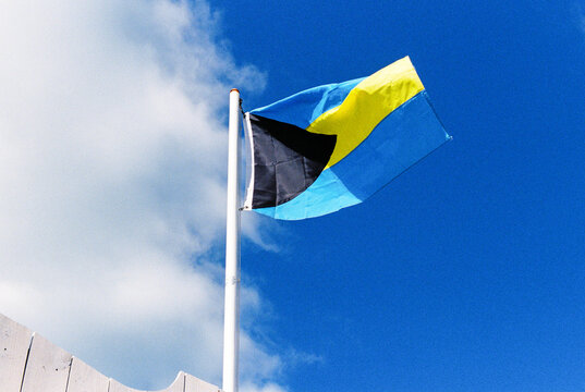 Flag of The Bahamas Flying Against Blue Sky
