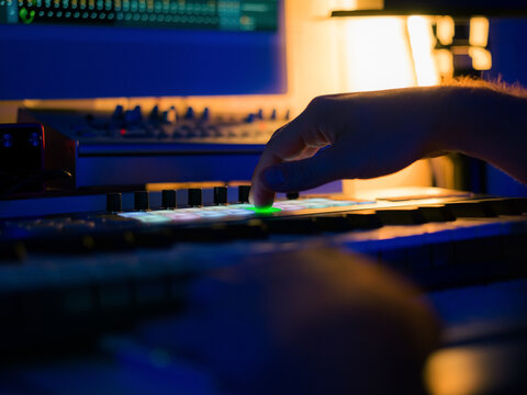 Artist making electronic music using midi keyboard