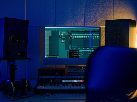 Music Production Setup Shows Computer and Studio Equipment in a Room