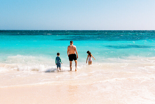 Man and children together on vacation in the Bahamas