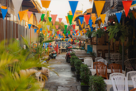 Colourful alley with outdoor cafe in Thailand 