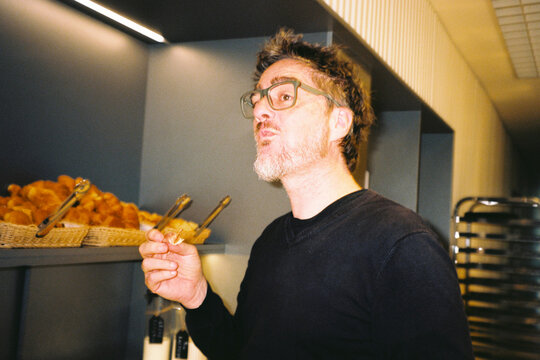 Man Eating At Breakfast Buffet